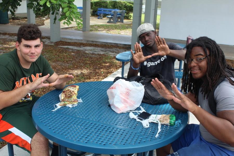 READY TO GO: Taking a break from practice just days before kicking off their season are (L-R) Inlet Grove Hurricanes sophomore Collin Kellar, junior Terence Graham and senior Albert Golden.
