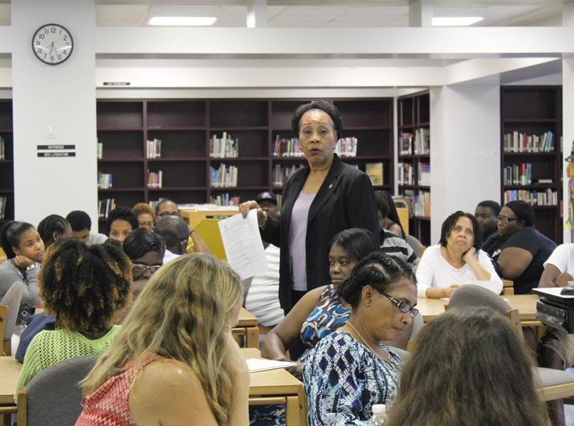 PARENT NIGHT: Compliance Manager, Juanita  Edwards discusses the School Wide Progress Monitoring Plan during the  Oct. 15 Title I Parent Night Meeting in the Media Center that preceded the Open House.