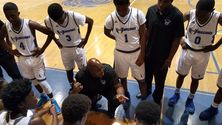 COUNTING DOWN THE SECONDS: Hurricanes varsity basketball team and Head Coach Alfred Jones going through the final play of their Jan. 5 game. 