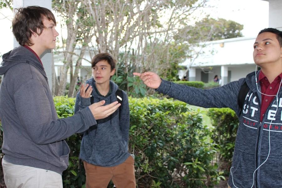 I DISAGREE: (L-R) International Baccalaureate student Jacob Heine, Pre-Architecture student Dalton Nutter and IB student Giovanni Rodriguez engage in a compelling debate about memes. 