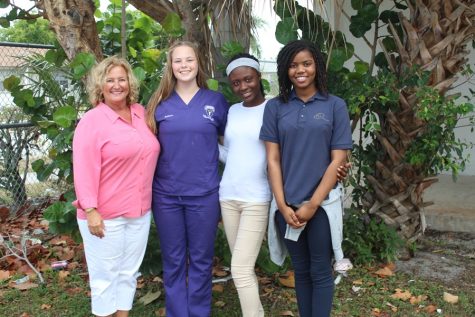 GIRLS IN GOVERNMENT: Pre-Law Academy Lonnie Martens (from left), met with the three students who have been selected from Inlet Grove to attend Girls State 2016 at Florida State University in Tallahassee: Rainne Kasik, Joudelyne Altidor and Linedjie Joseph. Mrs. Martens presented each of them with a travel bag full of toiletries for their trip as a gift from the Pre-Law Academy. The students were selected and will be sponsored by the American Legion Auxiliary to attend the weeklong mock government/leadership conference. Inlet has had three girls win the 2+2 Scholarship (two years at Tallahassee Community College, two years at FSU) since I have been involved with this organization, said Mrs. Martens,  and we hope to have another winner this year! The two alternates selected, not pictured, are Jamina Claude and Jordae Cole.
