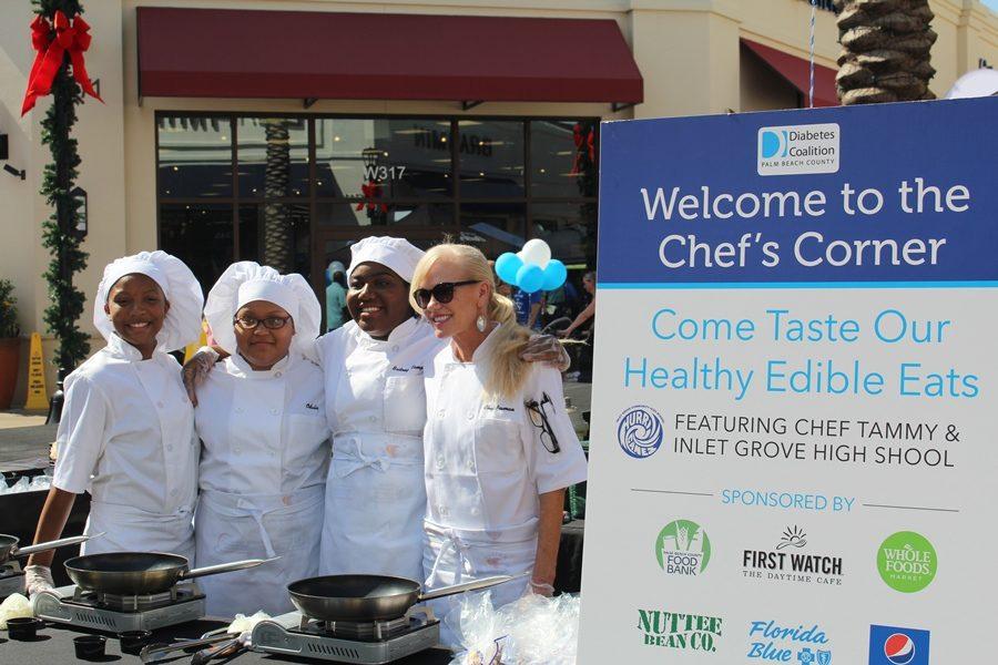 THIS IS HOW WE DO IT: From left, Taikijanae Grundy, Odalys Velaquez and Brittany Campbell, Culinary students of Chef Newman, conducted cooking demonstrations and handed out healthy samples, with supplies provided by the Palm Beach County Food Bank, during Diabetes Awareness Day at the Palm Beach Outlets Mall on Nov. 12. Medical Academy students also conducted diabetes risk assessments, Digital Design students helped with children’s activities, Journalism students captured the scenes, while Drumline students set the beat, as the Canes once again volunteered during a community event, this time for the Diabetes Coalition of Palm Beach County. (NOTE: The Canes are not responsible for the typo in the billboard.)

