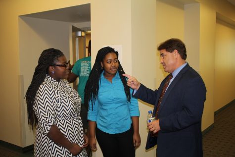 RICK SANCHEZ: Brianna Luberisse, left, and Tatyana Moise talk with the television correspondent and news anchor of more than 30 years after his session on Covering News in the Age of Trump during the Florida Scholastic Press Association District 7 meet.