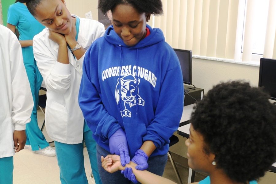 YOUR REPRESENTATIVES AT WORK: Medical, Engineering, Digital Design, Journalism and Pre-Law students spent the day teaching, inspiring and working with middle school students at Congress Middle School on Dec. 16.  “Our students are proving today that Inlet is an amazing school that offers opportunities that other schools do not,” said the Medical Academy’s Nurse Rebecca Blair. “As always, they are representing Inlet professionally and with pride.”