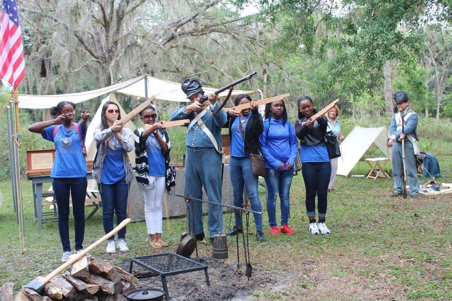 LEARNING ABOUT THE PAST: At Riverbend Park in Jupiter during the Jan. 27 re-enactment of the Battle of Loxahatchee, the Canes were there -- specifically, members of the National Honor Society.
 