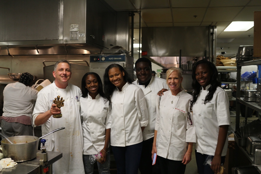 SERVING+UP+HONORS%3A+Sailfish+Marina+Executive+Chef+Steve+Bernstein+%28from+left%29%2C+smiles+with+Hurricane+Culinary+Academy+seniors+Chris+Burford+Fitzgerald%2C+Quantajaia+Bedminster%2C+Sal+Sargent%2C+Chef+Tammy+Newman+and+Zyanna+Adolphe.+The+students%2C+who+have++interned+at+the+Sailfish+since+January%2C+gave+Chef+Bernstein+a+trophy+for+Best+Mentor+Senior+Class+2017.