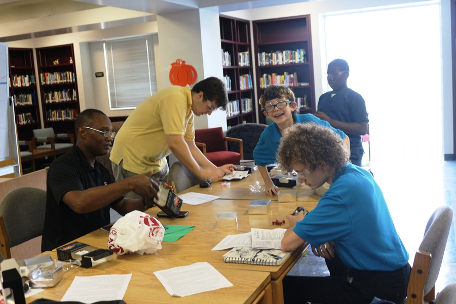TAKING FLIGHT: Adviser Mr. Tuck, from left, was joined by club members Kagen Harris, Xain Lawracy, Lordwill Louis and Kai Lawracy for what Mr. Tuck said was
