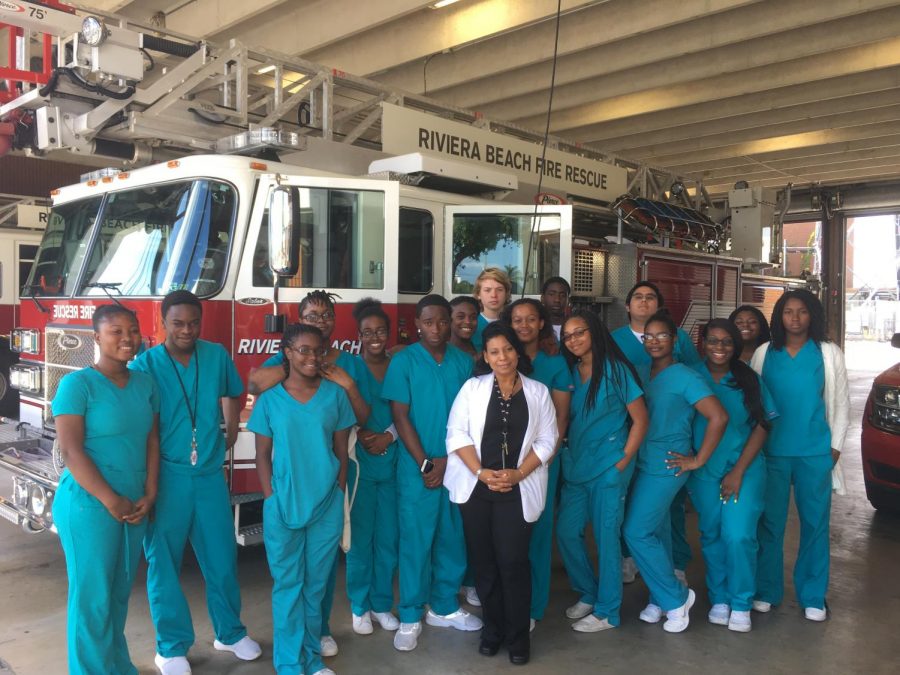 FIRE STATION: Mrs. Graham and the EMR students visited the Riviera Beach Fire station Nov. 29 to learn about emergency medical equipment, lifesaving measures and the real-life challenges of first responders. They also toured the facility and explored the emergency vehicles and equipment.  
