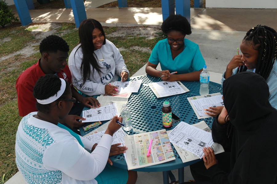 FRESH AIR, FRESH MIND: Students from Mr. Hanif's 2nd hour, take a brief moment to study for their test outside on such a beautiful day.