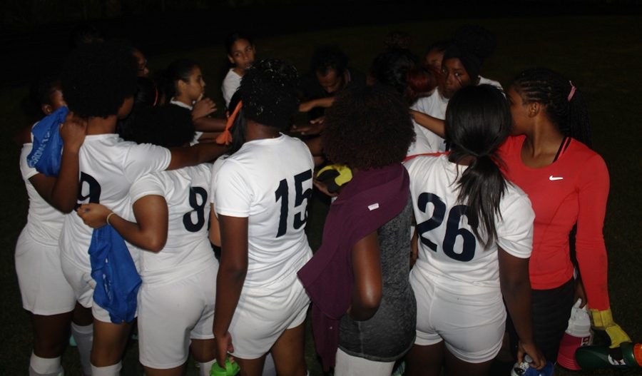 UNITY: The Lady Canes show theirs following an earlier game this year.
