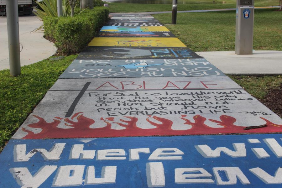 DESIGNING THE FLOOR: The street designs created by Nova Southeastern University students to show off clubs and extracurricular activities caught the eye of the Hurricane photographers who attended the Leadership & Multimedia Conference Jan. 27 at the Davie/Fort Lauderdale campus.