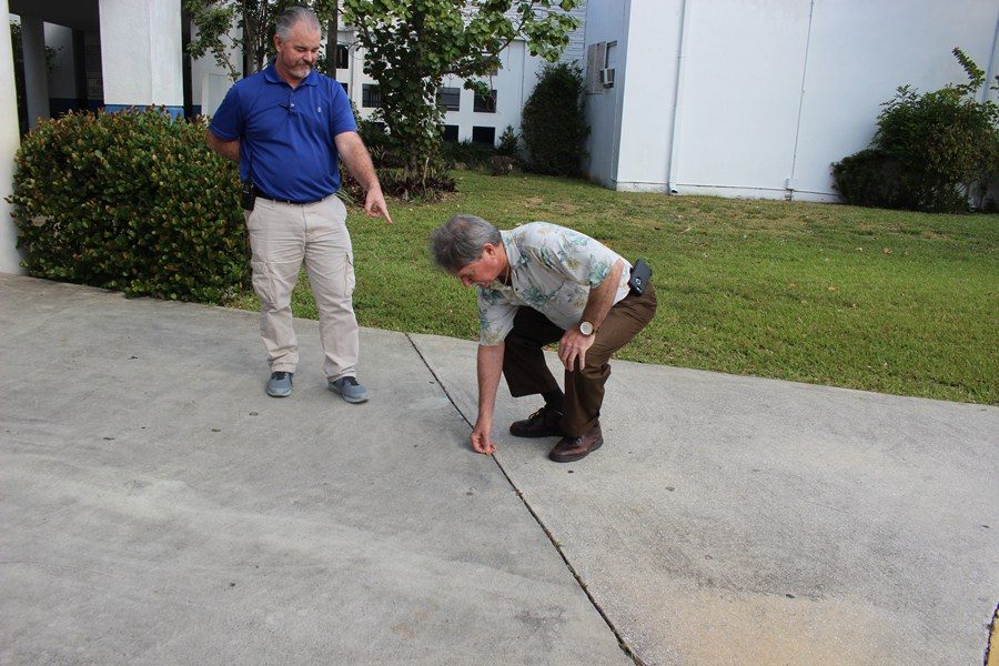 A PENNY FOR YOUR THOUGHT: Mr. Myszkowski and Mr. McDermott at war for loose change.