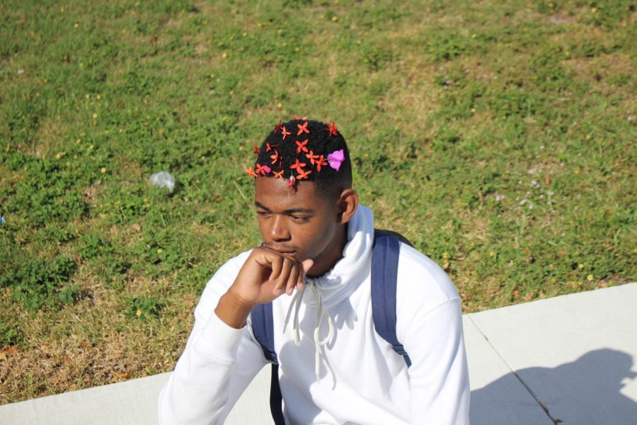 ARTISTIC: I am here and I am   setting trends, said senior Davidson Prophete as he lets the flowers of creativity blossom.