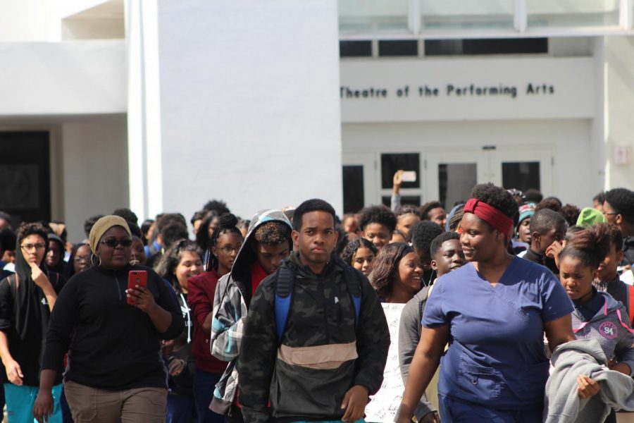 TOGETHER WE STAND: Students host a walk out for those who lost their lives during a school shooting.