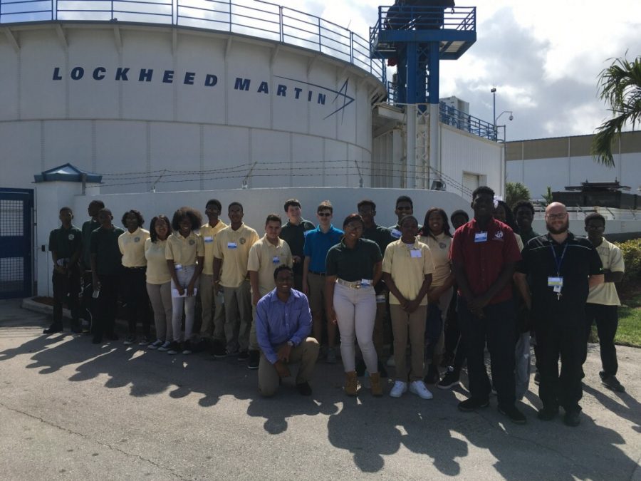 ON THE WATERFRONT: Senior Hawonce Luberisse (in red shirt) said his experience going to Lockheed Martin, on a field trip led by Pre-Architecture instructor Mr. Towey, was very interesting, as he learned more about how engineering began and how robotics happens.