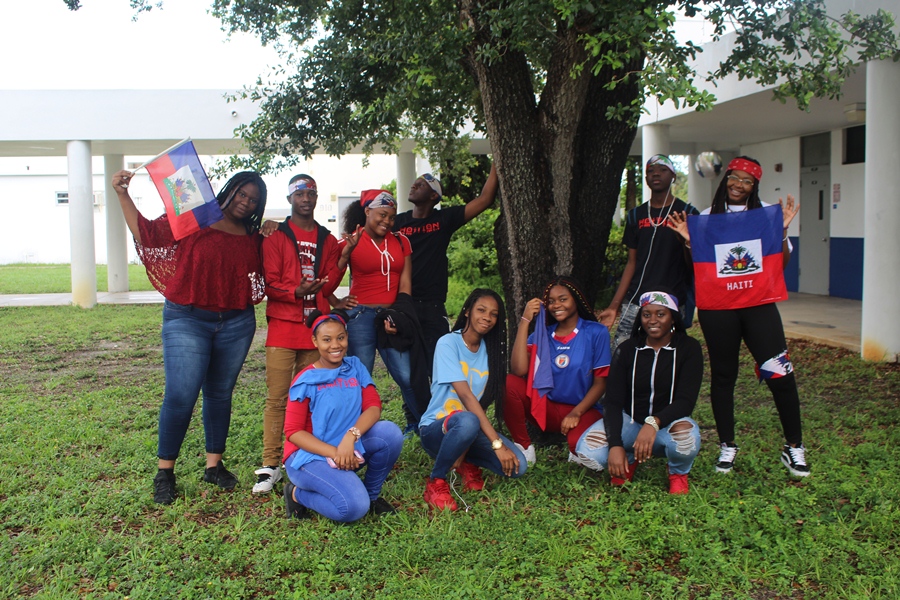 SAK PASE: Haitian Canes gathered together to take a photo in honor of 'Haitian Flag Day'. Today symbolizes the day that the first Haitian flag was adopted, which was on May 18, 1803.