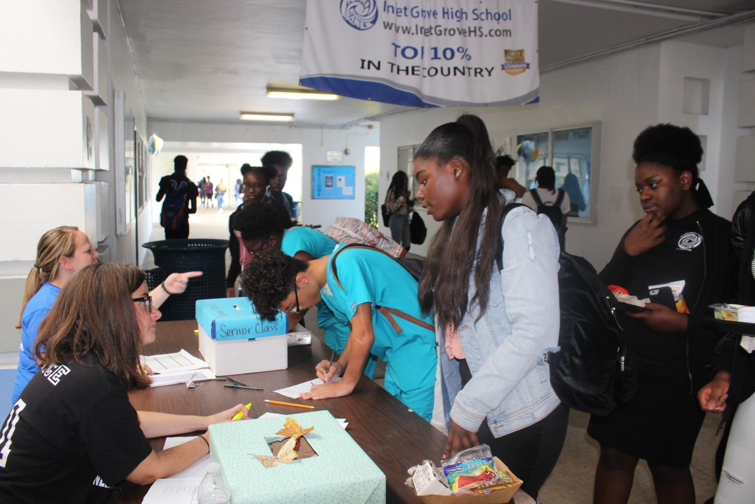 VOTE,VOTE,VOTE: Juniors and seniors gathered in front of the cafeteria to vote for their fellow representatives.