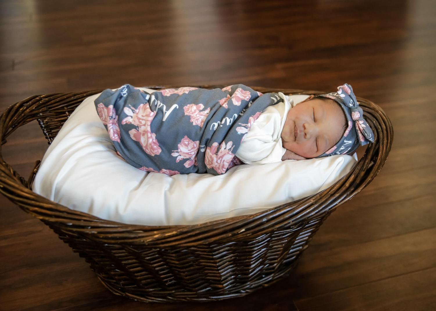 BUNDLE OF JOY: Mr. Baker, Community School assistant principal, shared with the Inlet Grove family his new family addition, Adelaide Grace Baker, born Oct. 14.