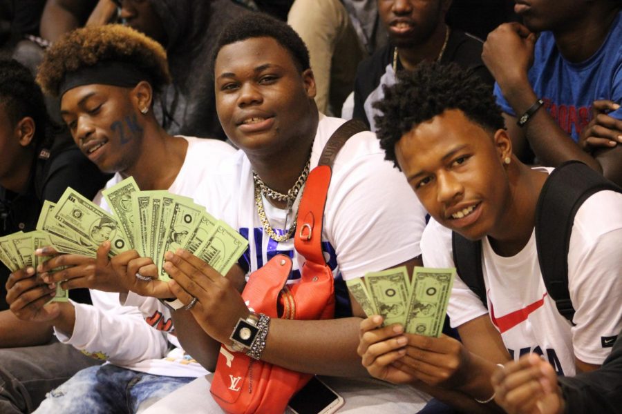 MONEY MOVES: Senior students flash smiles and show off their school spirit at the make-up pep rally  Friday. 