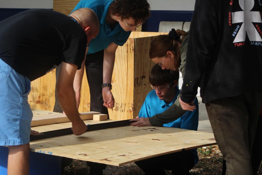 BOX IN THE MAKING: Mr. Rice, Marine Technology teacher and his students are currently building a box for the athletic director to store stuff in. 