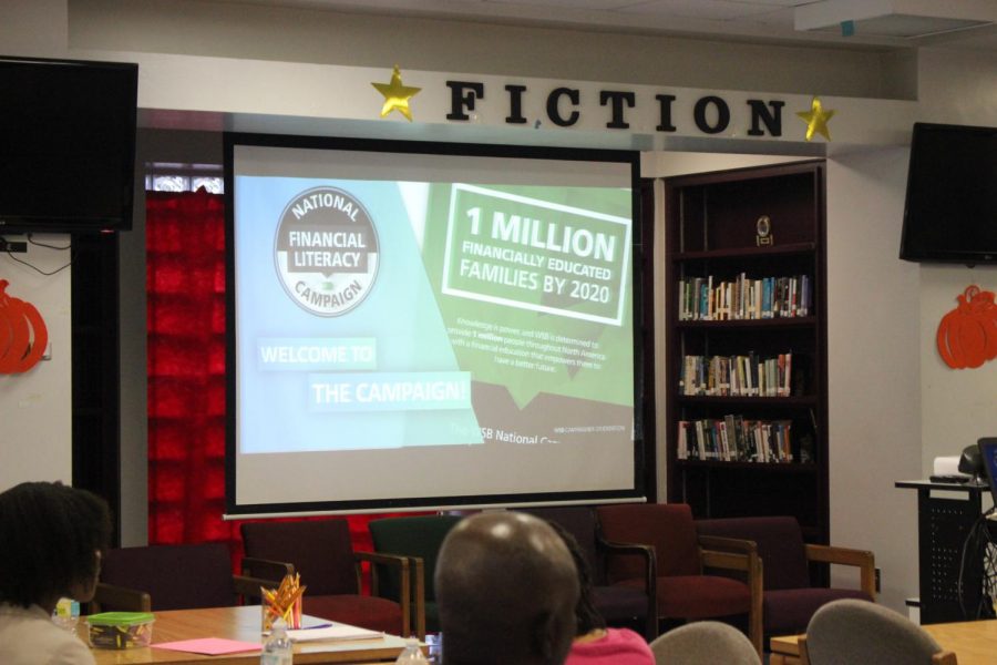ABOUT THOSE ECONOMICS: Students, parents and teachers gathered in the Media Center on Sept. 20 for wisdom on the subject. 