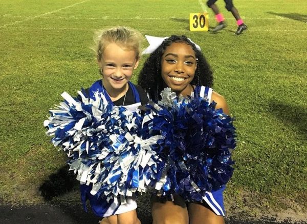 CHEER MINI ME: Gabriella Cartwright spends the night with the Lady Canes participating in their cheers.