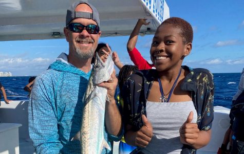 EXPLORING FOR FUN: Mr. Rice accompanies his students in the Adventure Club on a fishing field trip and celebrates Stacey Pauls, birthday, a student in the Maritime Academy.