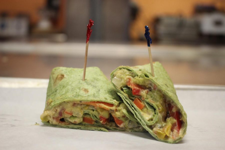 EAT THE RAINBOW: Todays vegetarian option for Teacher Lunches was a veggie wrap made with carrots, sweet peppers, avocado, cucumbers, and hummus, all wrapped up in a spinach tortilla. 