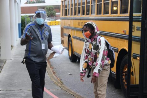 NEW NORMAL: Students, teachers, and administrators take the proper precautions as students return back to school physically to ensure that everyone is safe.