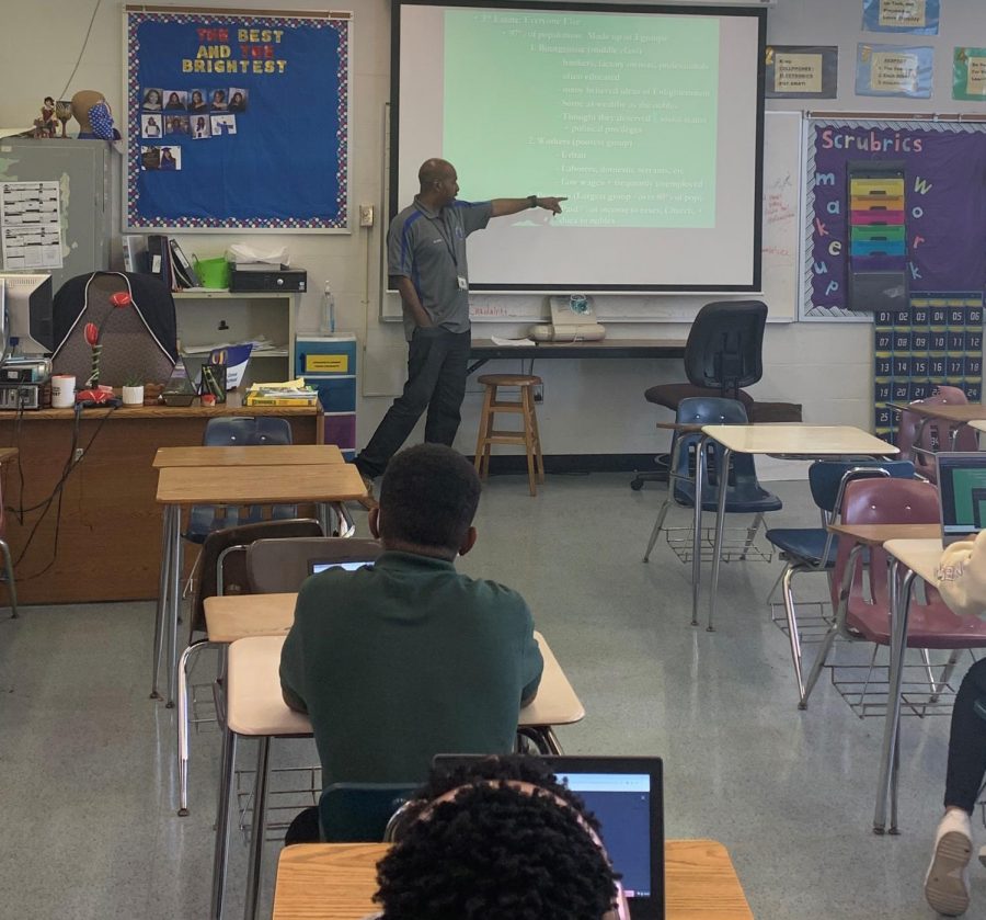 EDUCATE: Mr. Sutton giving a lecture to his second period class. The World History teacher said he hopes students leave his class with more understanding of themselves and the world around them. 

