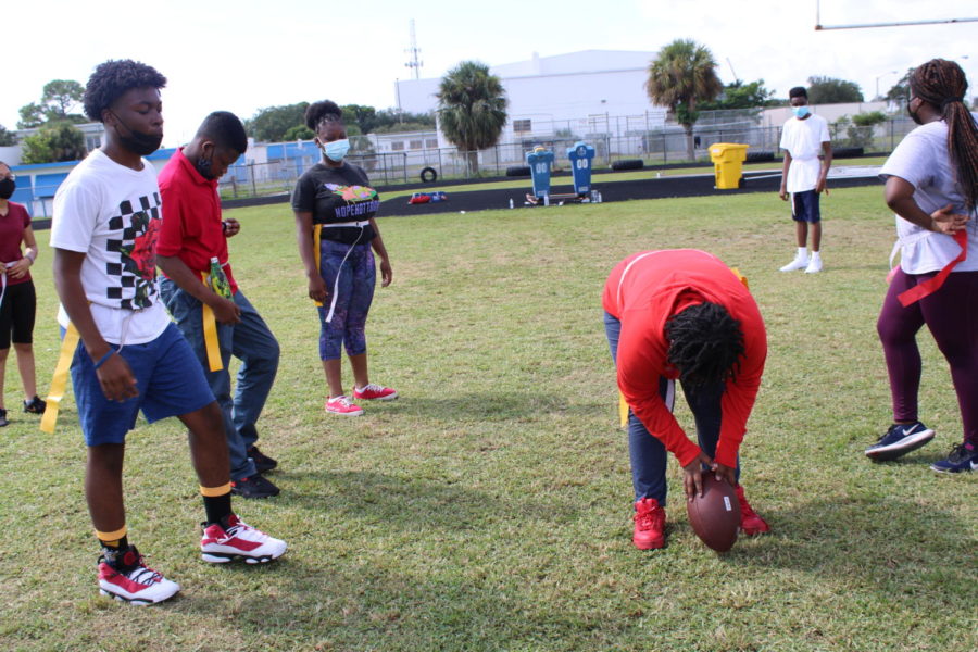 RED VS. YELLOW: Students compete in a friendly game of flag football.
