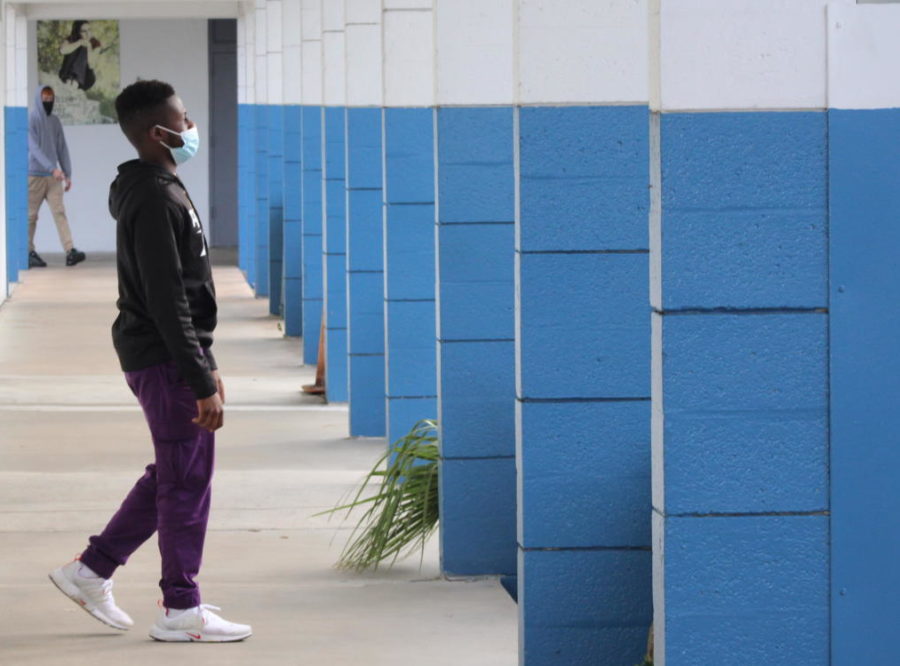 RULE OF THIRDS: Junior Shakir Forestal in the Medical Academy  walking in a hallway