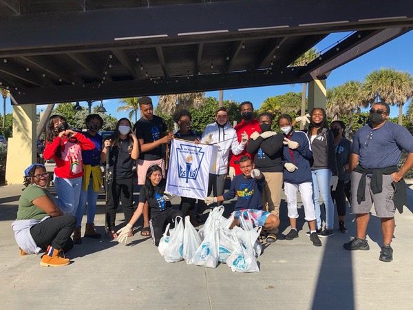 PILE UP: NHS members went to Lake Worth Beach for a community service event by picking up pieces of trash on Jan. 15. After the clean-up, members took a moment of relaxation by eating Chick-Fil-A then some played Uno while others played football and soccer.
