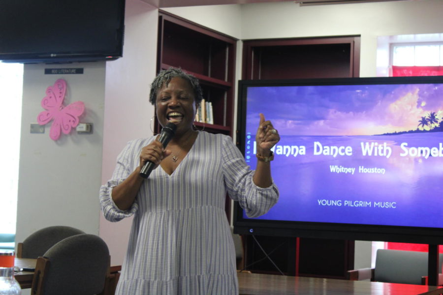SUPRISE GUEST: Principal Latson took a quick stop at the karaoke night by Multicultural Club to sing I Wanna Dance With Somebody by Whitney Houston. 