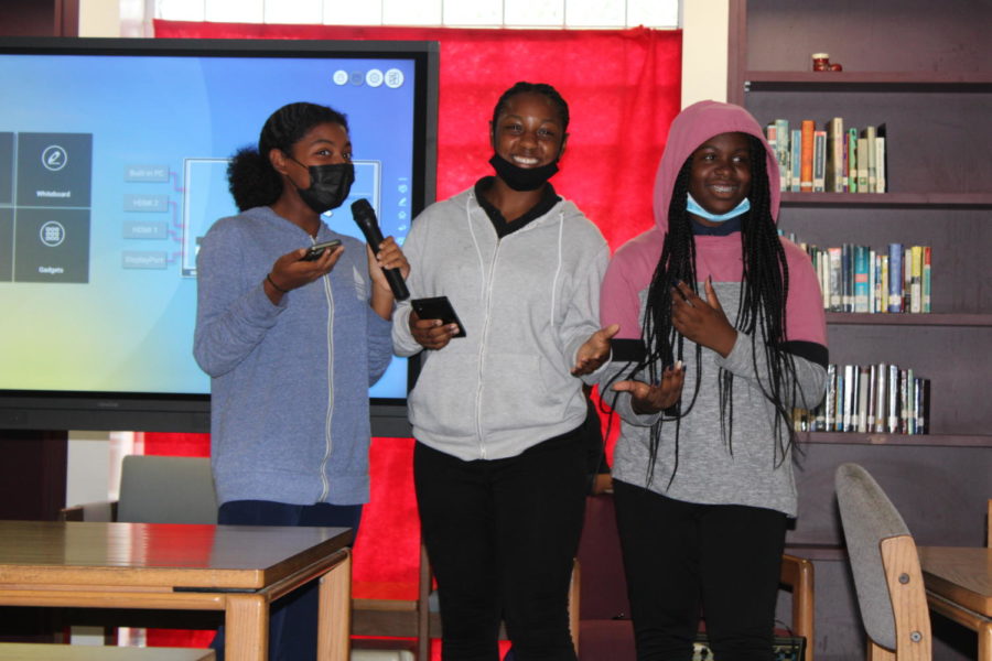 SINGING ALONG: The Multicultural Club hosted a karaoke night where attendees sang different songs from all over the world. A comedy act was also performed by Kaelyn Haines, right, Adrianna Lizana, left, and Karma Mcleod, middle.