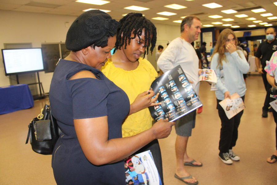 OBSERVING: Inlet Grove staff welcomed parents and possible future Canes by introducing them to academic programs and clubs on Mar. 30. 