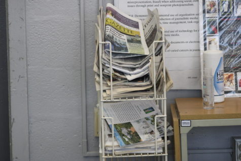 NEWSPAPER: Mr. Hanif keeps a stack of todays and past newspapers from the Palm Beach Post in his class for students to enjoy.