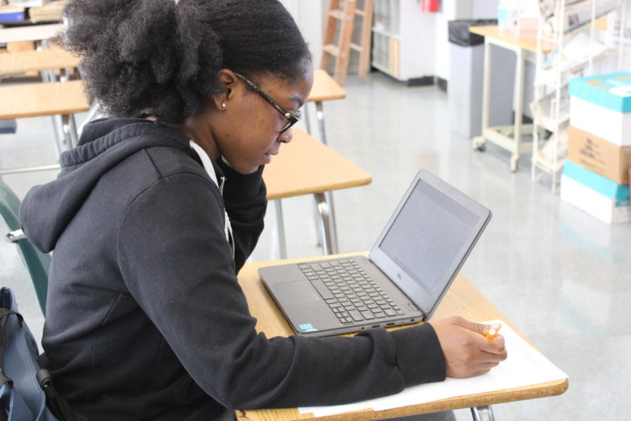 COMMITMENT: Laura Gedeon a Senior in the Pre- Medical Academy, made time to make up her Journalism exam she missed on the previous day due to SAT testing. I feel like im going to do good on this midterm because I have plenty of resources, said Gedeon.