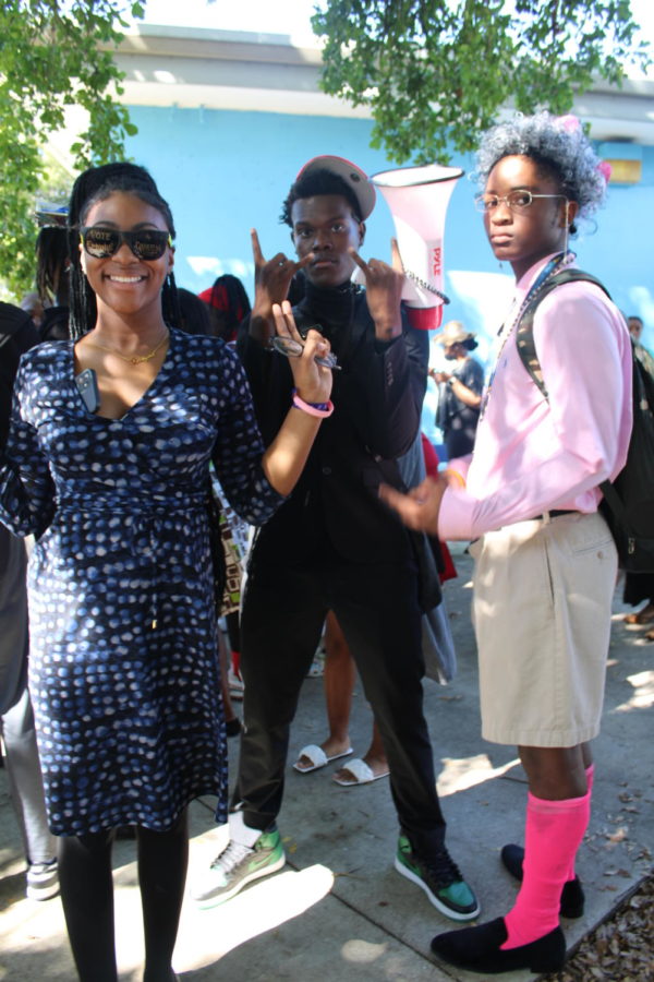 (from left) Leahyana Wallace, Reese Adams, and Kelvin Mccray are dressed in their elderly outfits in celebration of day one of spirit week.