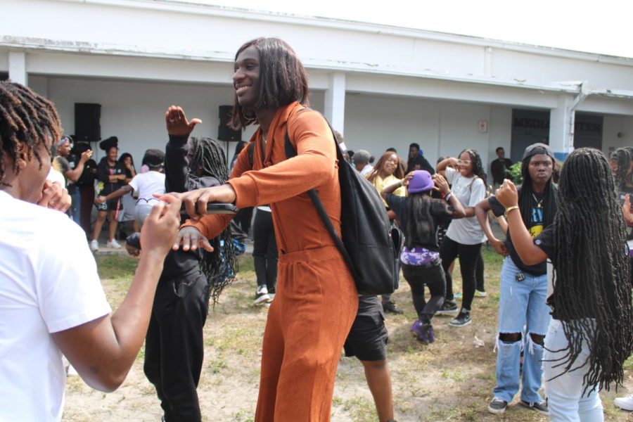 SWITCHING SIDES: Dancing to the beat, music was being played during lunch. Students dressed up as their type for the final day of Spirit Week. 