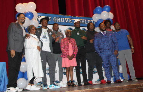 SIGNING DAY: IGHS Football athletes come together to sign their National Letters of Intent.