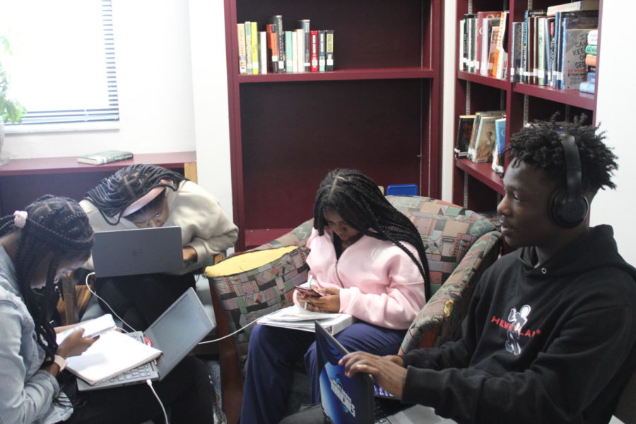 STUDY: Students in the library reviewing for upcoming assignments and quizzes