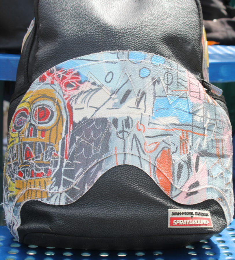 CREATE: One of Jean Michel-Basquites famous artworks is highlighted on this Sprayground bookbag.