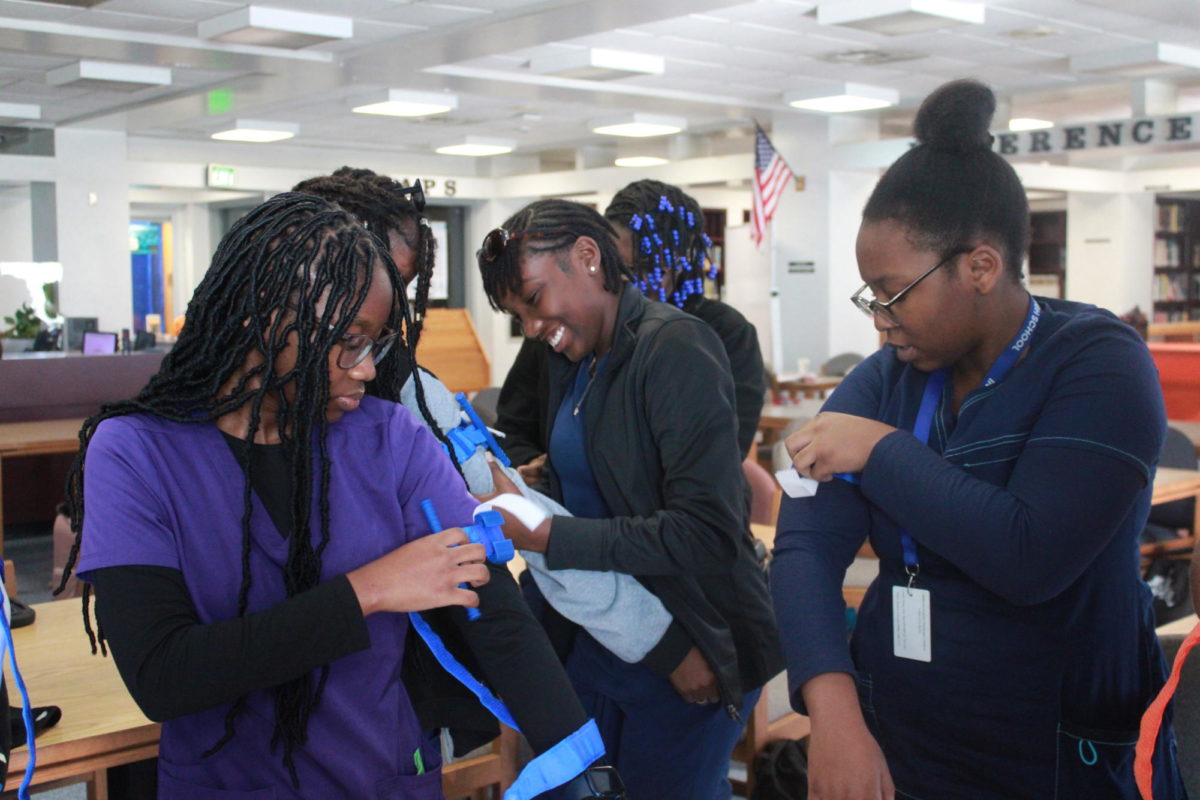 SAVE A LIFE: The medical students were given a presentation in the Media Center by Registered Nurses, and were taught how to stop bleeding and how to survive life-threatening injuries.