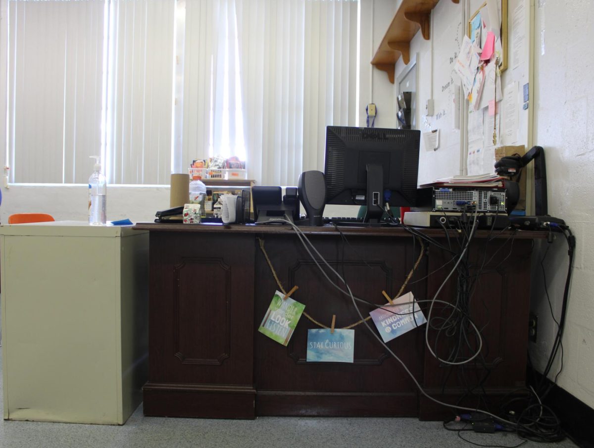 WORKSTATION: The teachers desk is the first thing to be seen when walking into Mr. Morehouses classroom. Where he sits, if hes not walking around, and gives instructions.