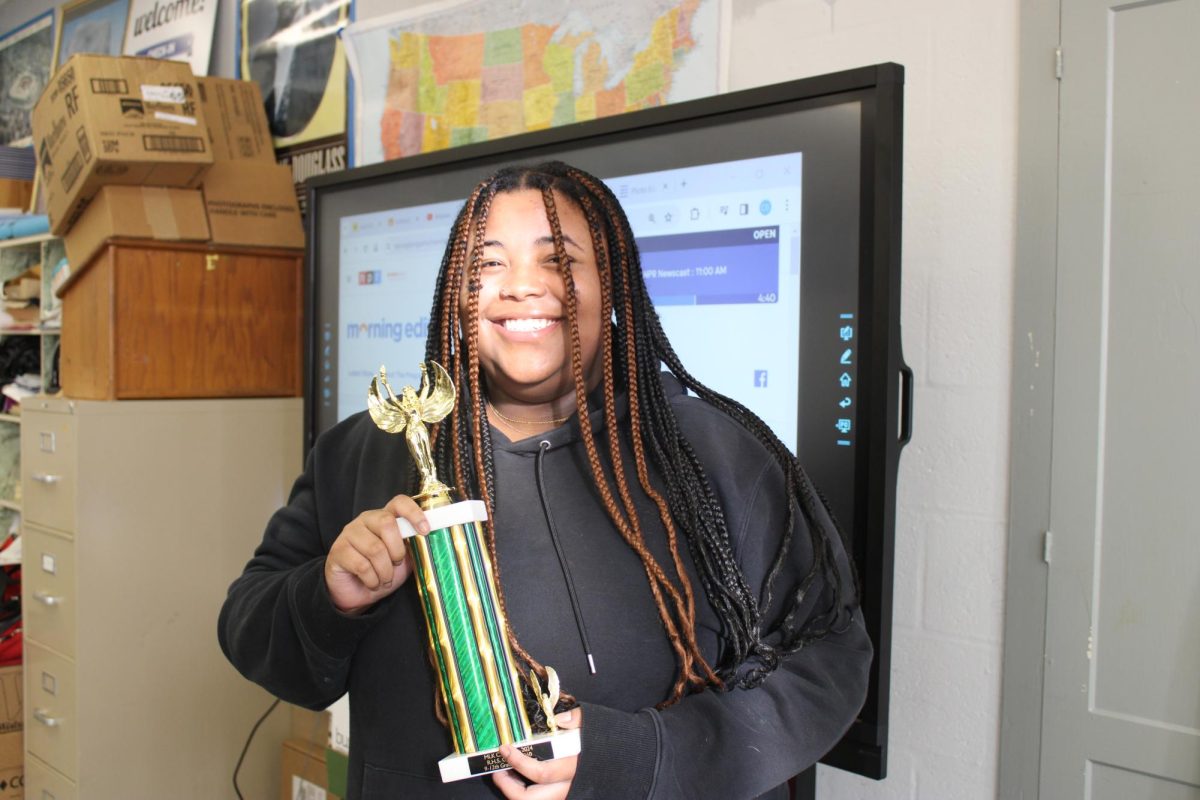 AT LAST: Shyanne Paul, an early admin student, makes an appearance in Mr. Hanifs class to retrieve her trophy. Shyanne received a third place trophy for her essay in the 2024 MLK essay contest. She was among the three seniors who placed in the contest.