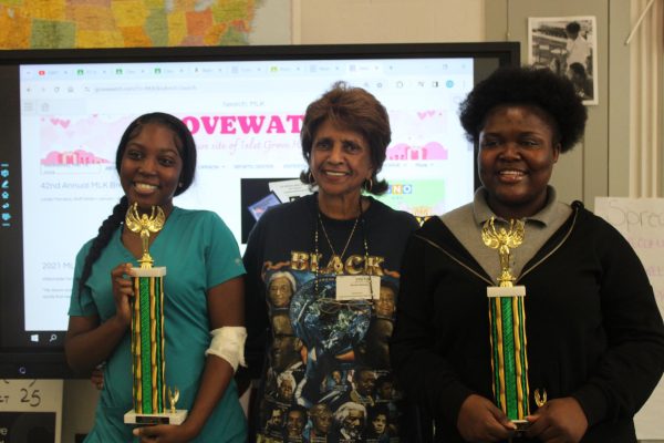 BLACK EXCELLENCY: Ms. Nelson came by to drop off 3 trophies for students who won the MLK competition. Students Brianna Moneus, who won 1st place, and Sheranah Dorcent, who won 2d place, came to room 203 to retrieve their awards.
