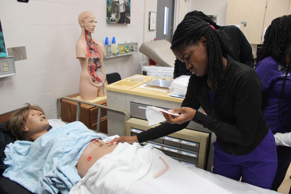 BEYOND THE BAG: The junior LPNs were engaged in a practical session on April 5, refining their skills in the lab. Specifically, students like Acsa Adrien mastering the technique of creating precise circles tailored to the size of a patients stoma.