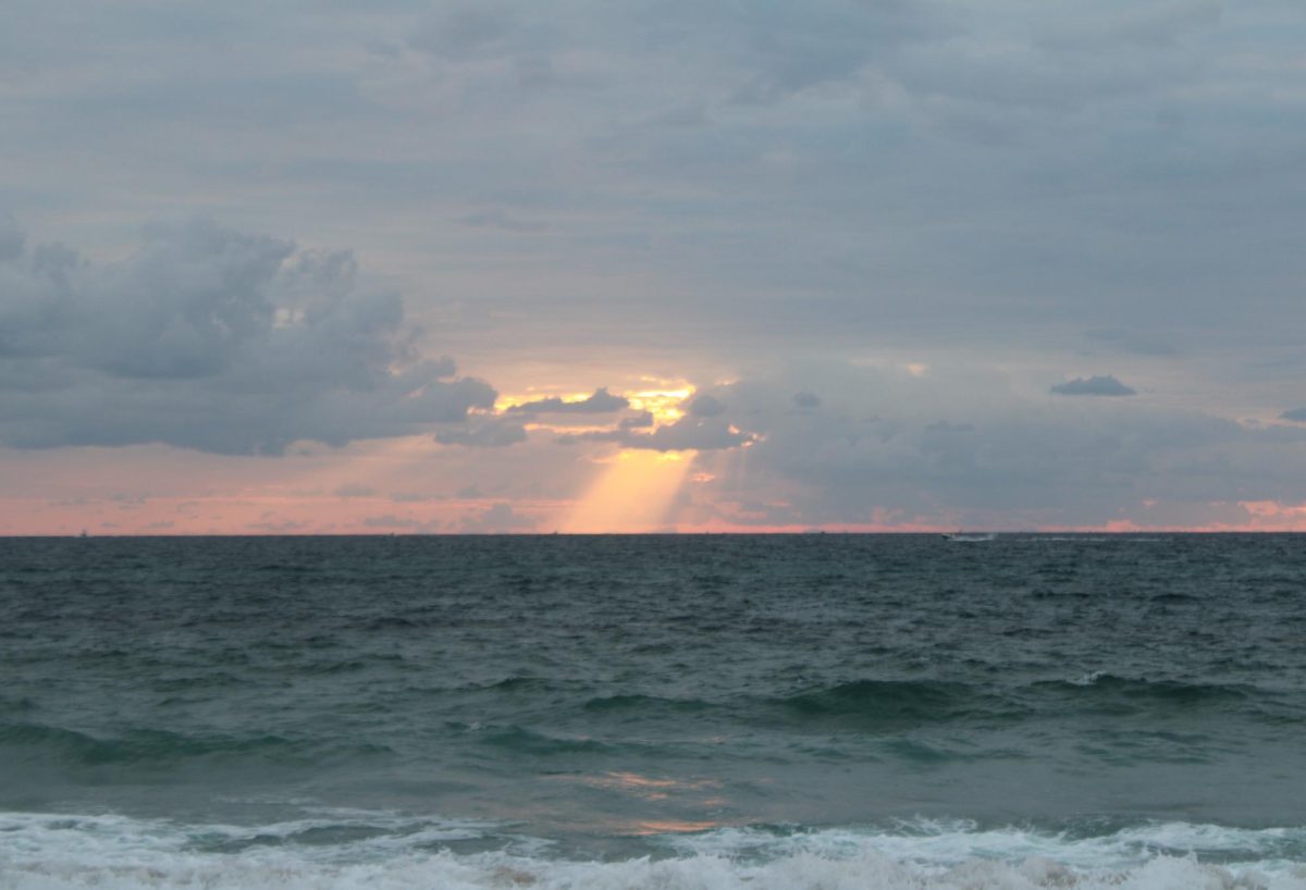 SUNRISE TO NEW HORIZONS: In Aug. 17, senior Canes celebrate the beginning of the final chapter in their high school journey at 6 AM on Singer Island beach. 