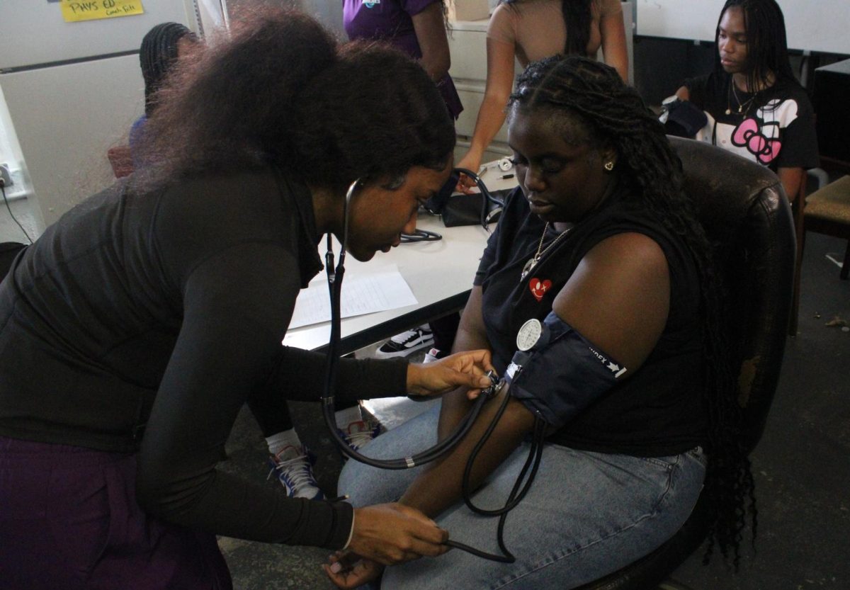 HEALTH FAIR: To keep track of Coach Donovan's students' progress throughout the semester, she allowed Mr. Hartung's junior LPNs to record their vital signs in the gym throughout periods 1-4 on Monday, Aug. 26.